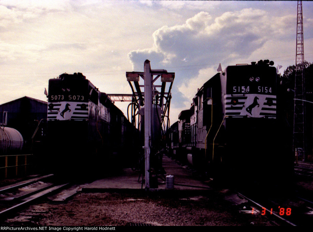 NS 5073 & 5154 at the fuel racks, with white flags